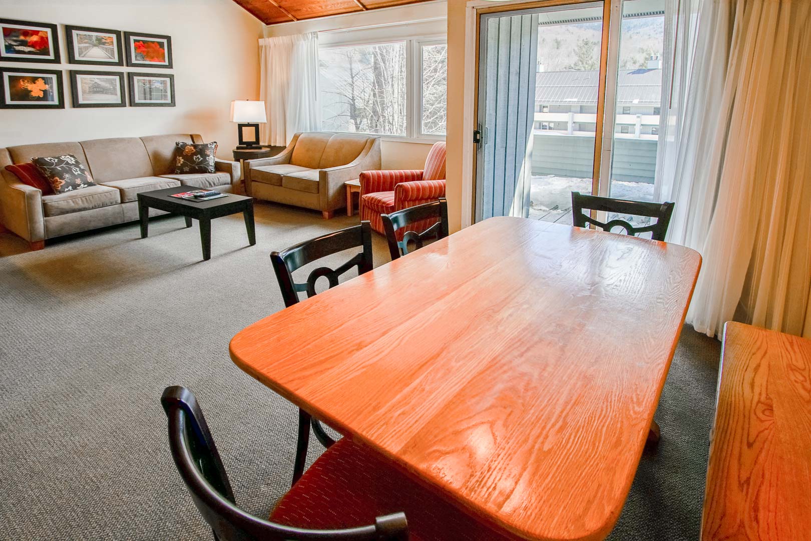 A spacious living and dining room area at VRI's Village of Loon Mountain in New Hampshire.